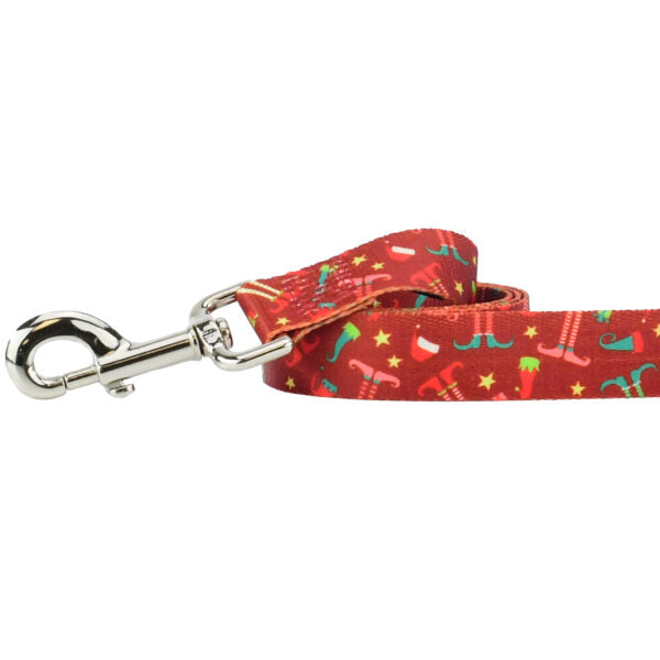 Close-up of dog leash with silver hardware featuring festive Christmas icons like trees, candy canes, and snowflakes by Primemarket7 - Earthstyle