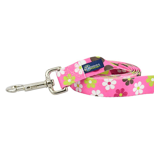 Close-up of dog leash with silver hardware featuring floral design with white flowers, geometric patterns on pink by Primemarket7 - Earthstyle